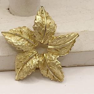 Vintage textured gold tone minimalist flower brooch